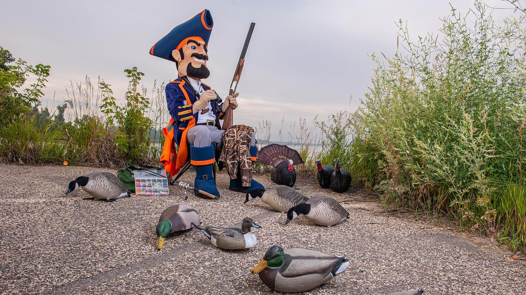 Max with decoy birds and a shot gun